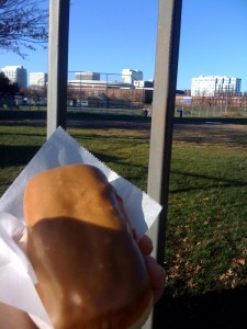 Eating a vegan maple bar in front of my old high school